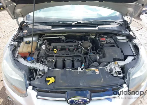 2014 Ford Focus Titanium from USA, damaged, VIN 1FADP3J28EL223087